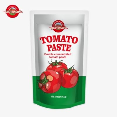 100%純度で100gのスタンドアップサケットトマトペストに包装されています